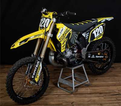 Suzuki RM250 Dirt Bike with Custom Made DeCal Works Graphics Designed by Nic Wright with Officially Licensed Pro Taper Logos