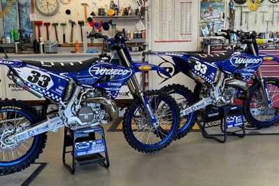 Yamaha YZ blue and white checkers dirt bike graphics on blue UFO plastic with Officially Licensed FMF Shorty Exhaust #33