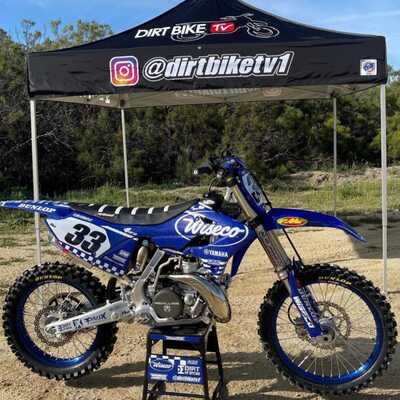 Yamaha YZ blue and white checkers dirt bike graphics on blue UFO plastic with Officially Licensed Dirt Bike TV Logos