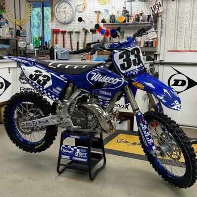 Yamaha YZ blue and white checkers dirt bike graphics on blue UFO plastic with Officially Licensed Uni Filter Logos
