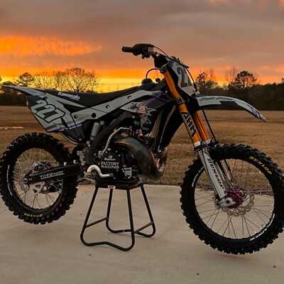 DeCal Works Custom Dirt Bike with white and black graphics, a purple accent and AHM forks