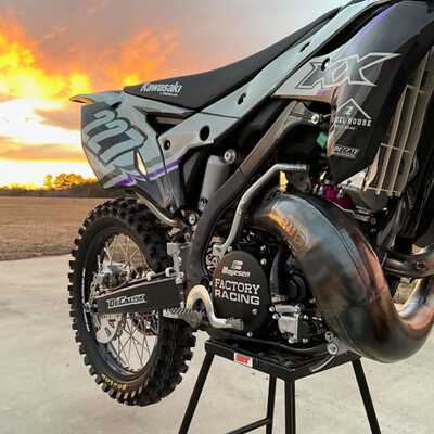 DeCal Works Custom Dirt Bike with white and black graphics, a purple accent and Dunlop Logos