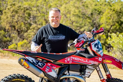 2023 KTM 350 XC-F with red and black dirt bike graphics with Officially Licensed ODI Grips Logo