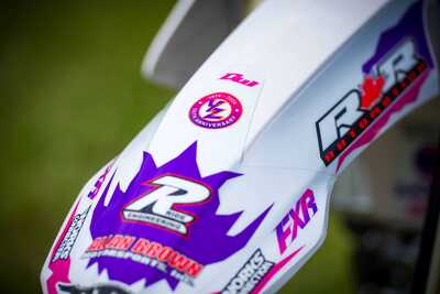 Purple and white throw back yamaha complete dirt bike graphics with purple and pink front fendor tip decal