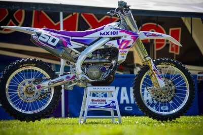 Purple and white throw back yamaha complete dirt bike graphics with #50 Austin Jones side view of YZF dirt bike